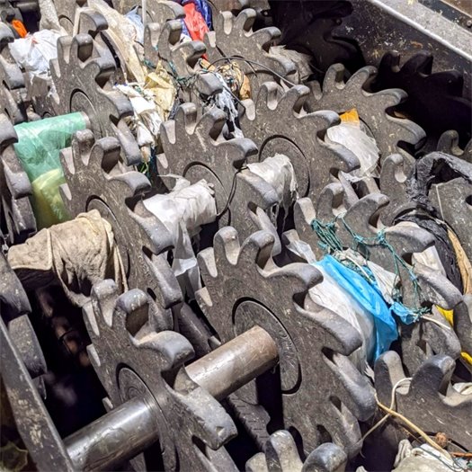Why can't plastic bags go into the recycling bin?  Beneath this mess is an important piece of sorting equipment called a mechanical screen.  Mechanical screens help sort through recyclables. Nonrecyclable items such as hoses, tarps, and plastic bags get tangled around the shaft of a mechanical screen and must be removed by hand.