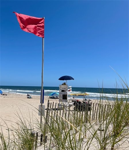 Red flag flying on beach in Nags Head.